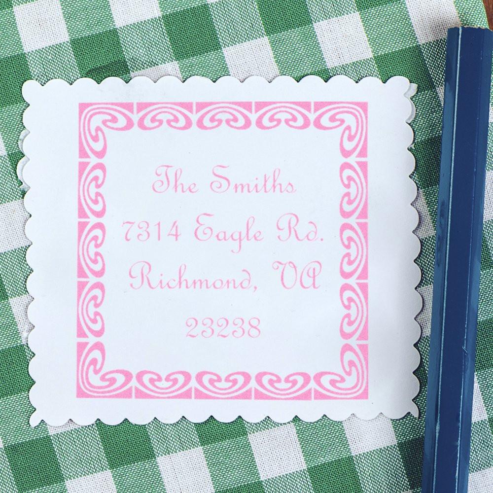 Personalized return address rubber stamp with decorative pink border and The Smiths mailing address.