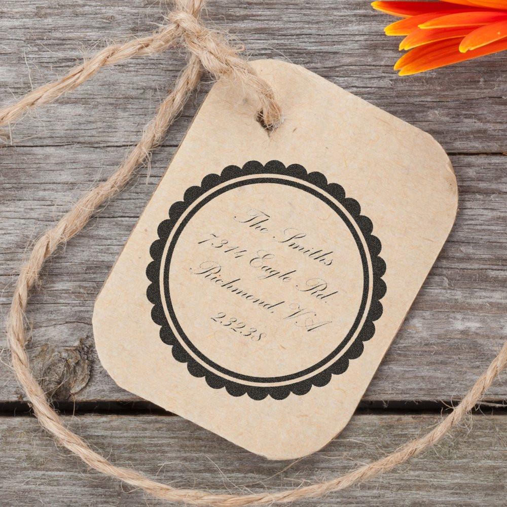 Custom wedding rubber stamp design on kraft gift tag for rustic personalized packaging and favors.