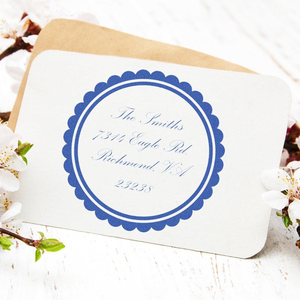 Personalized return address rubber stamp on a wedding envelope with blue circular design for invitations and mailing