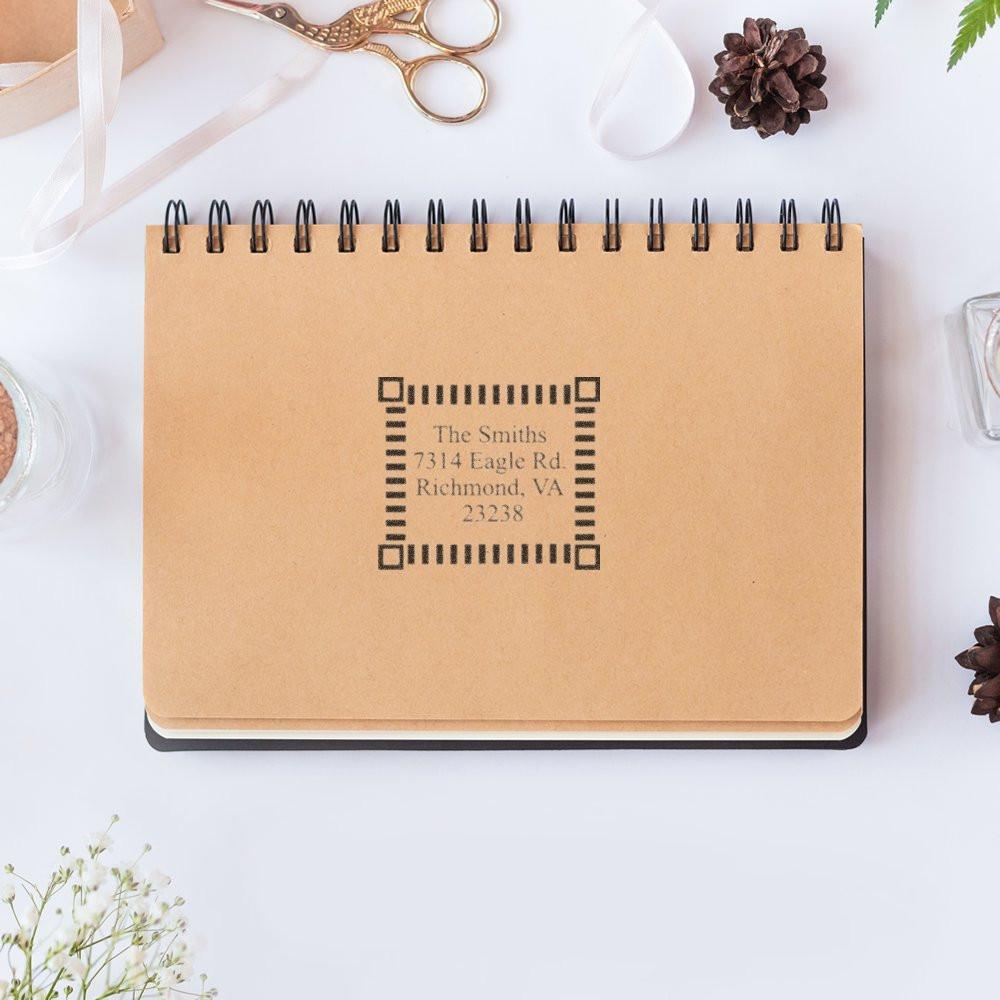 Personalized kraft spiral notebook mockup with custom address label: The Smiths, 7314 Eagle Rd, Richmond VA 23238.