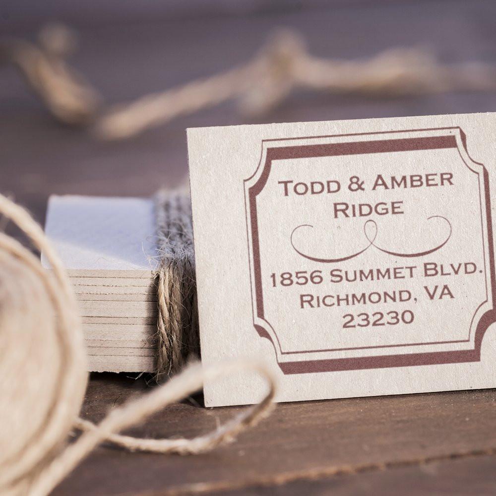 Custom return address rubber stamp for Todd & Amber Ridge, Richmond, VA, shown on a gift tag with twine.