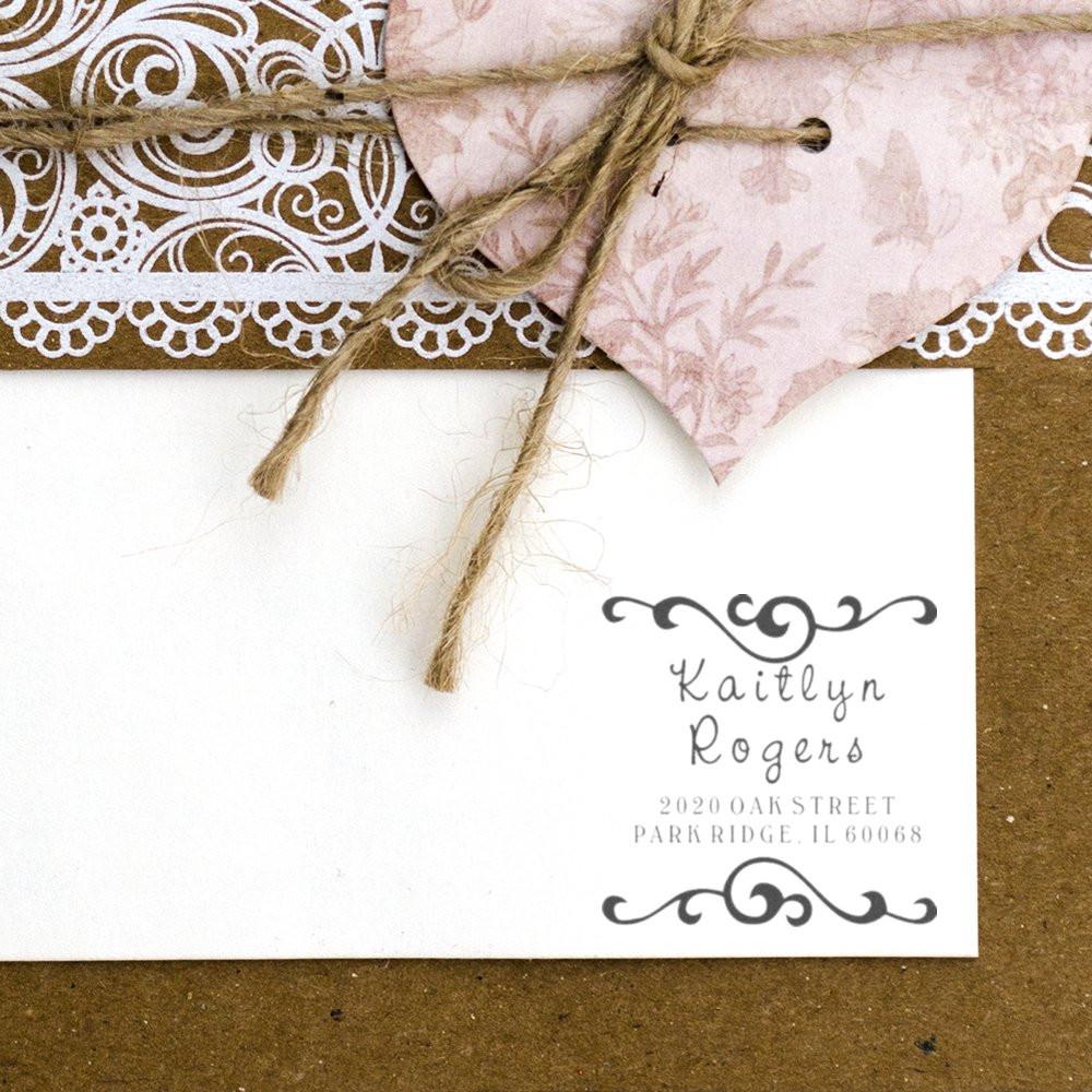 Custom return address rubber stamp for wedding invitations, featuring elegant script name and decorative flourish design.