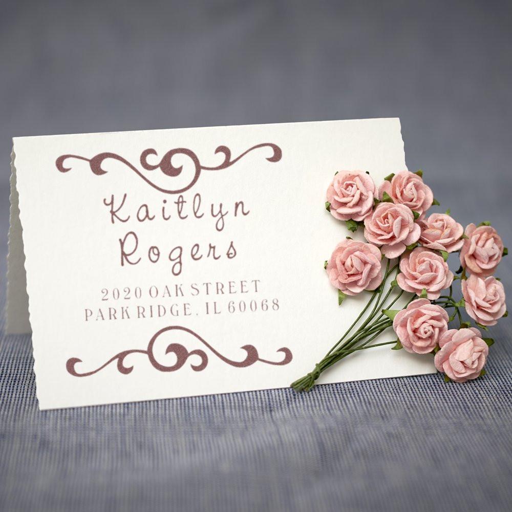 Personalized return address rubber stamp with elegant script and floral design for wedding invitations and stationery.