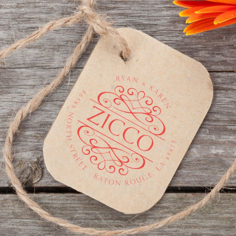 Custom address stamp monogram on rustic gift tag with return address, ideal for wedding stationery and branding.