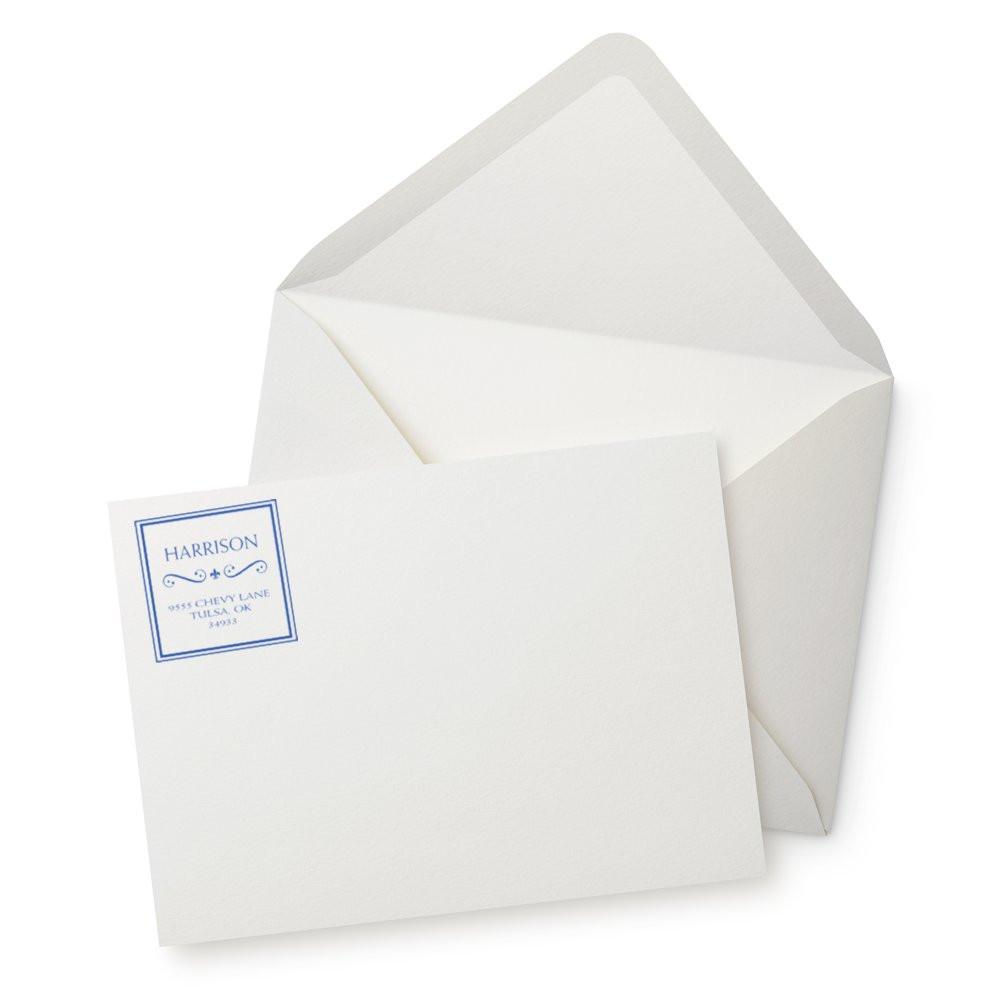 White mailing envelope with folded letter and blue address label for Harrisonclean correspondence for business mail delivery.