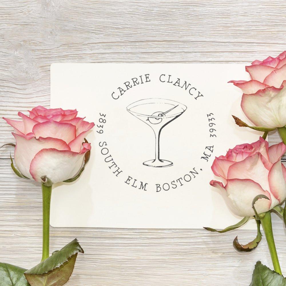 Custom rubber stamp with martini glass logo and return address for Carrie Clancy, South Elm Boston, MA.