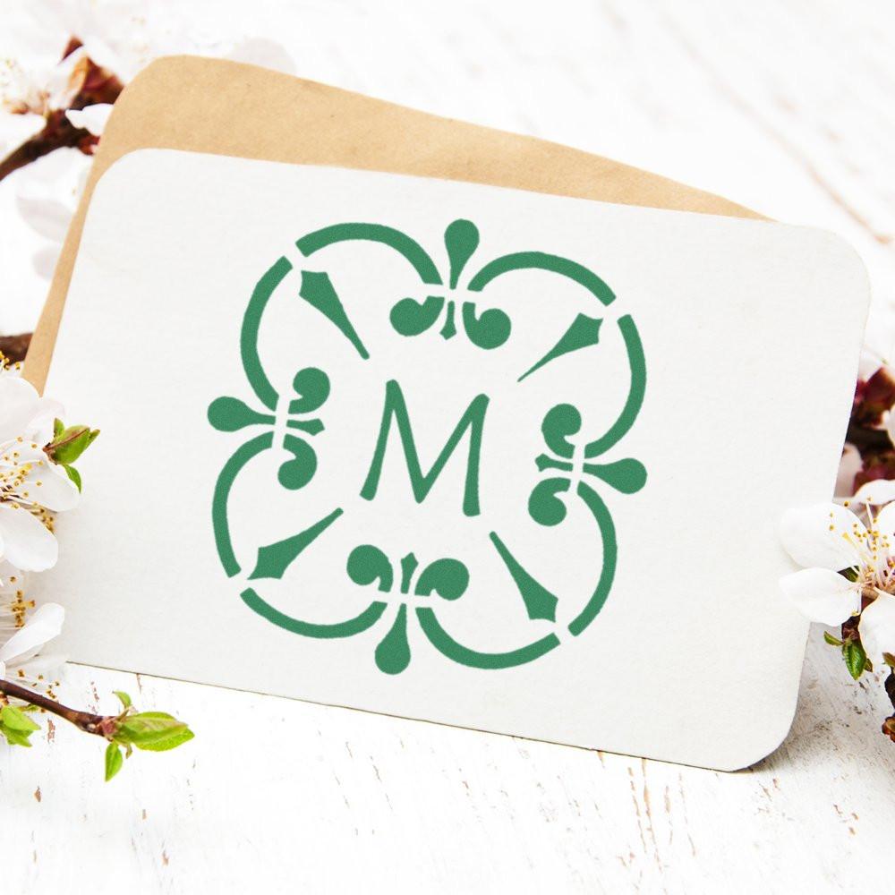 Personalized floral monogram rubber stamp with letter M for wedding invitations, envelopes, and custom stationery.
