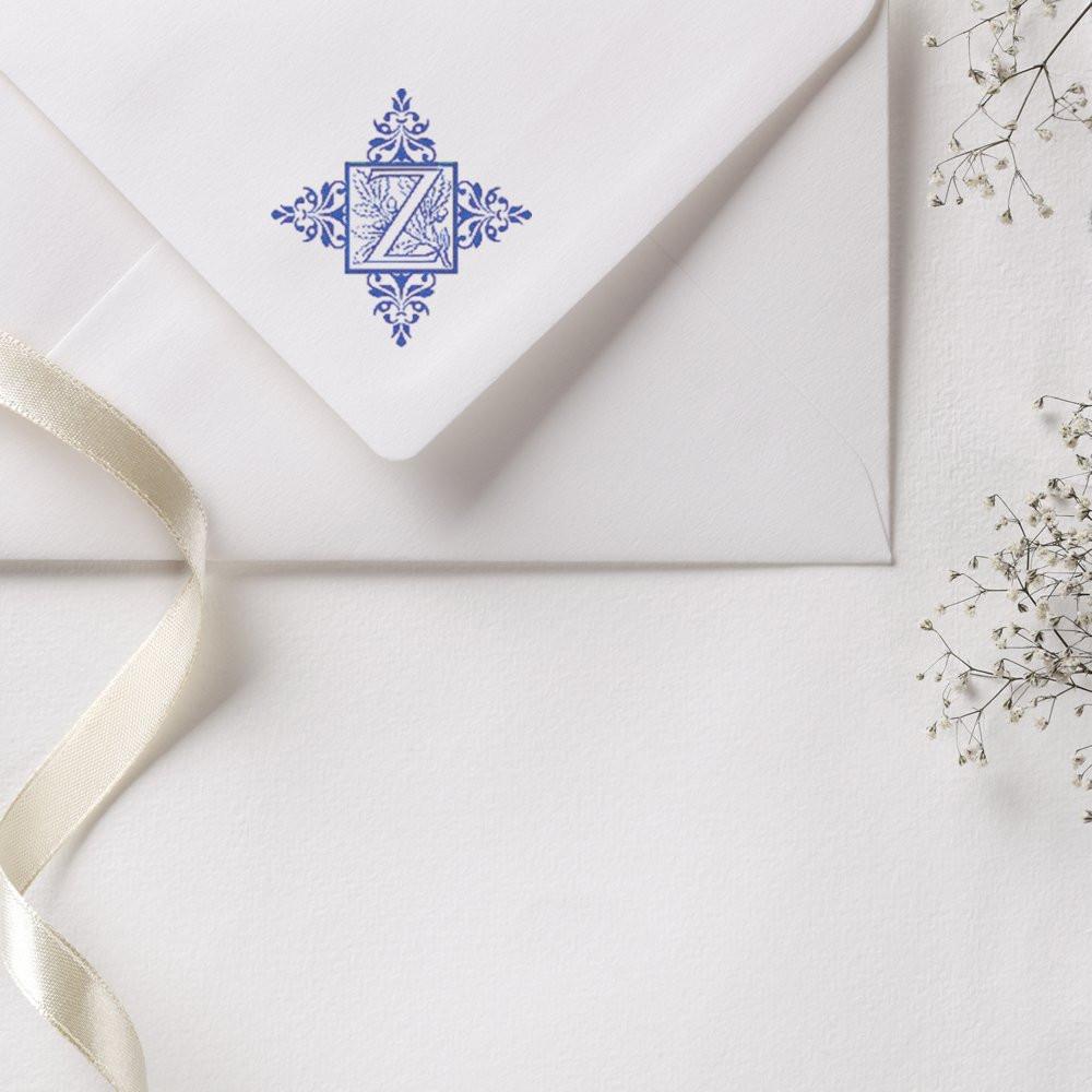 Elegant custom Z monogram rubber stamp on a wedding envelope for personalized invitations and stationery.