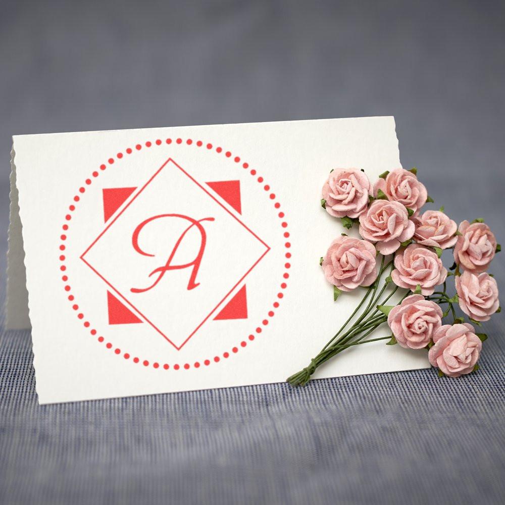 Personalized monogram rubber stamp with decorative red letter A, perfect for wedding invitations, stationery, and branding.