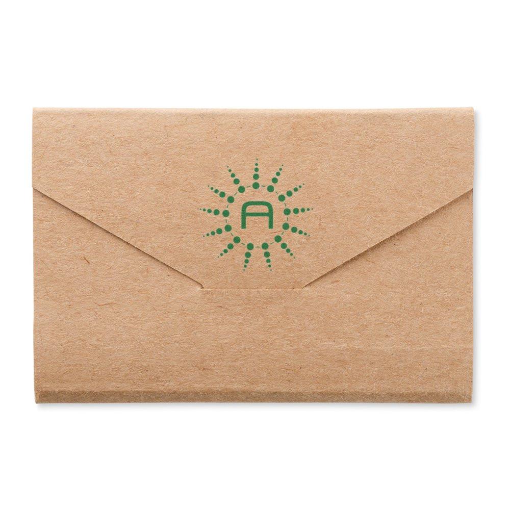 Custom rubber stamp logo on kraft envelope flap for branded business mail and packaging.