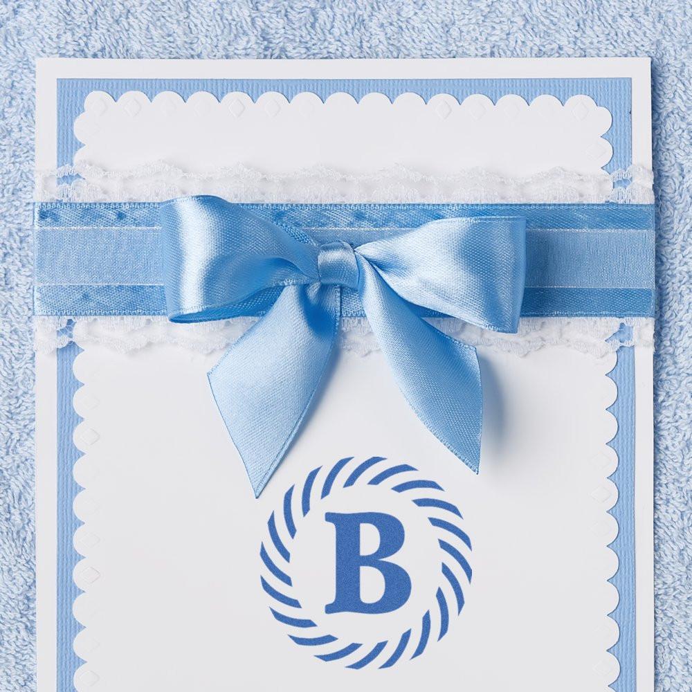 Custom blue monogram B rubber stamp on a baby shower card with satin bow