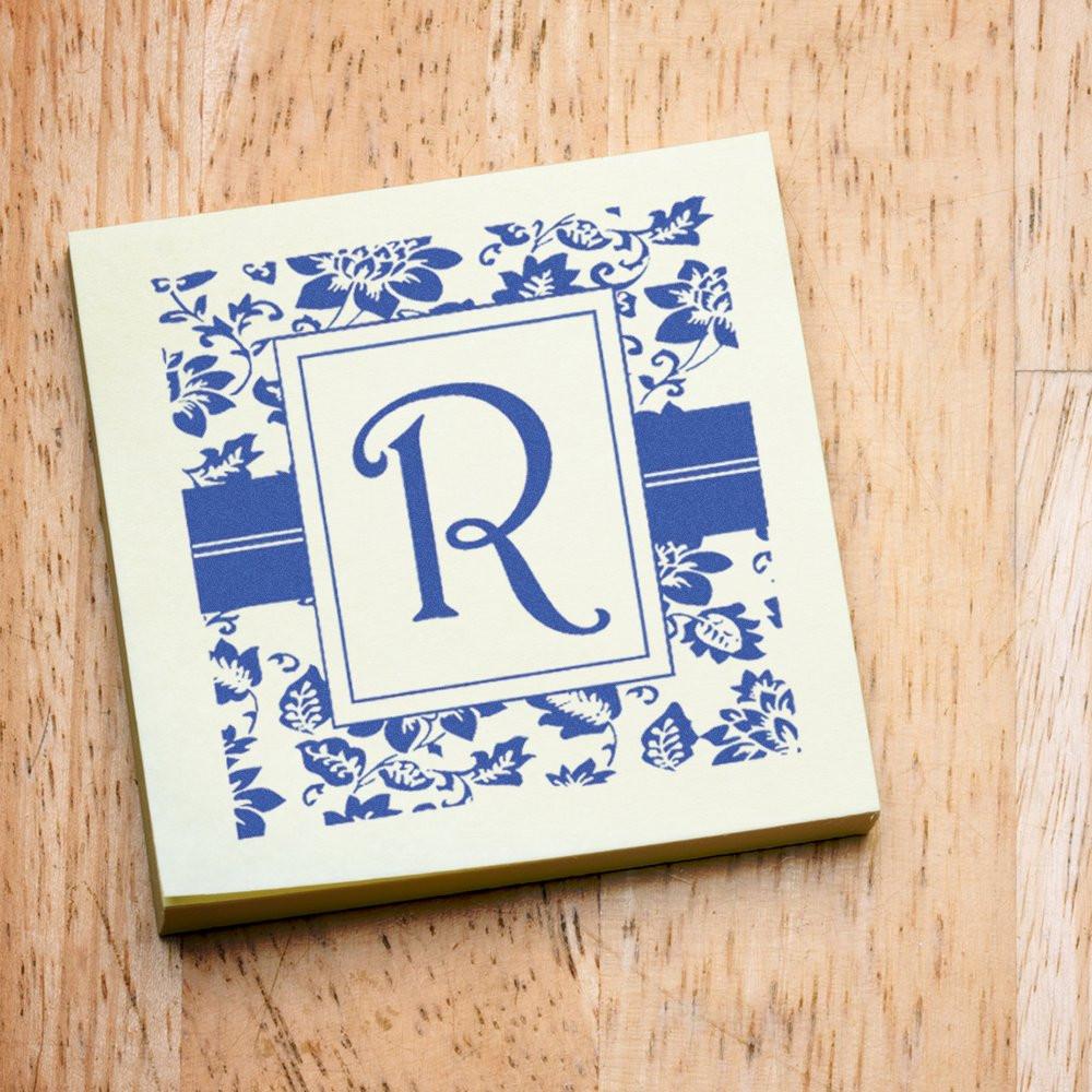Personalized monogram rubber stamp with floral border and letter R for custom stationery, invitations, and branding.