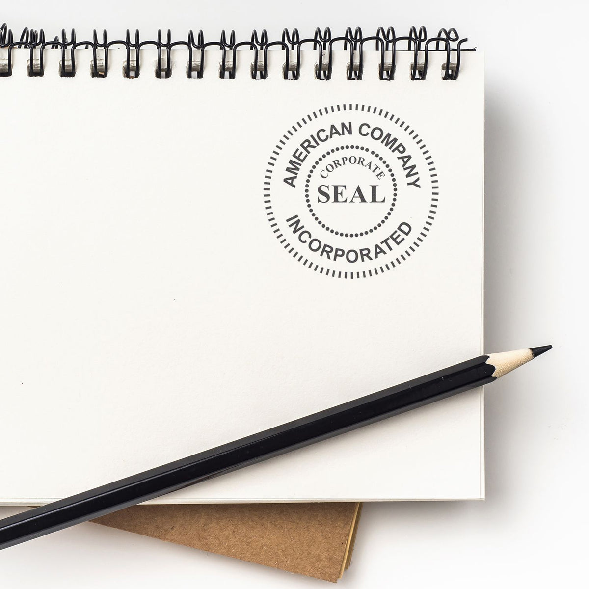 American corporate seal Incorporated on notebook with pencil, symbolizing company formation and legal compliance.