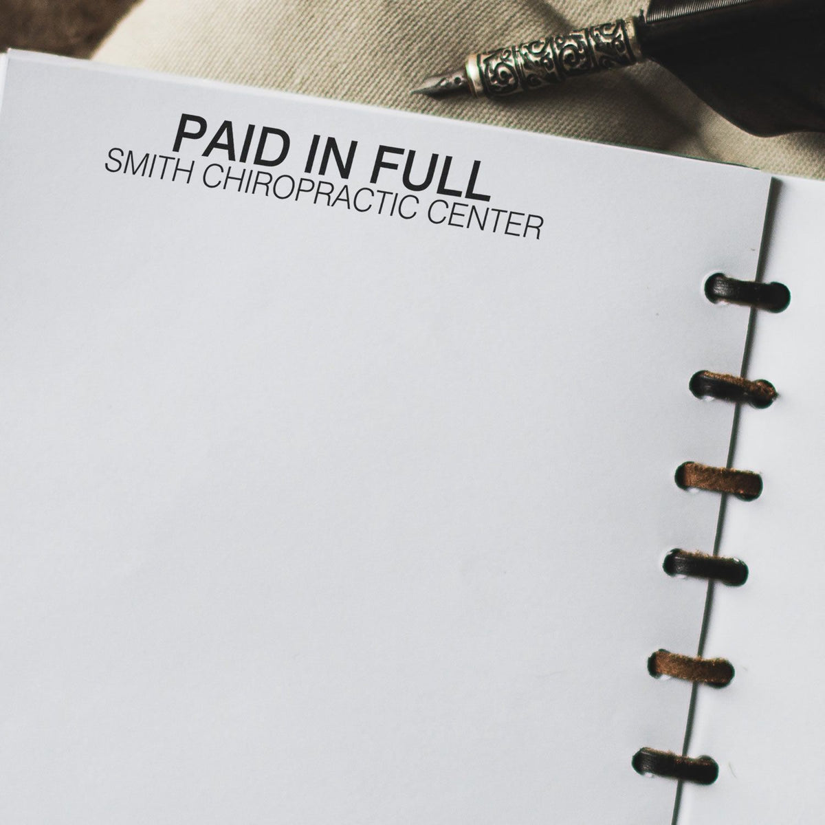 Paid in full notice for Smith Chiropractic Center on billing paperwork, indicating the medical invoice is settled.