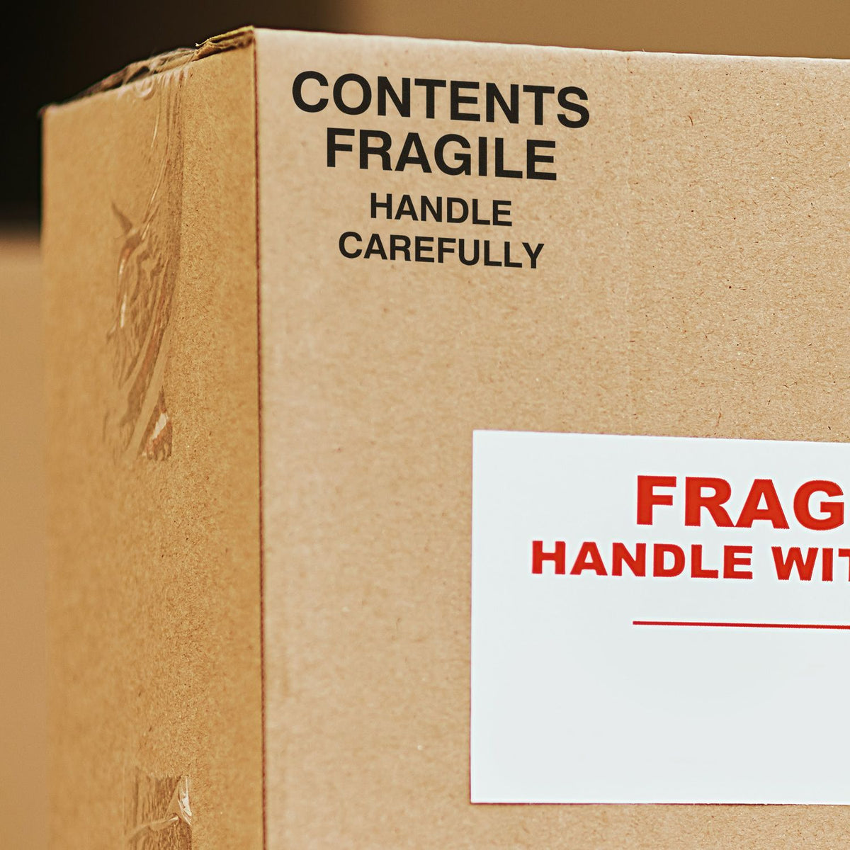 Shipping cardboard box marked Contents FragileHandle Carefully, showing packaging guidance for fragile items.