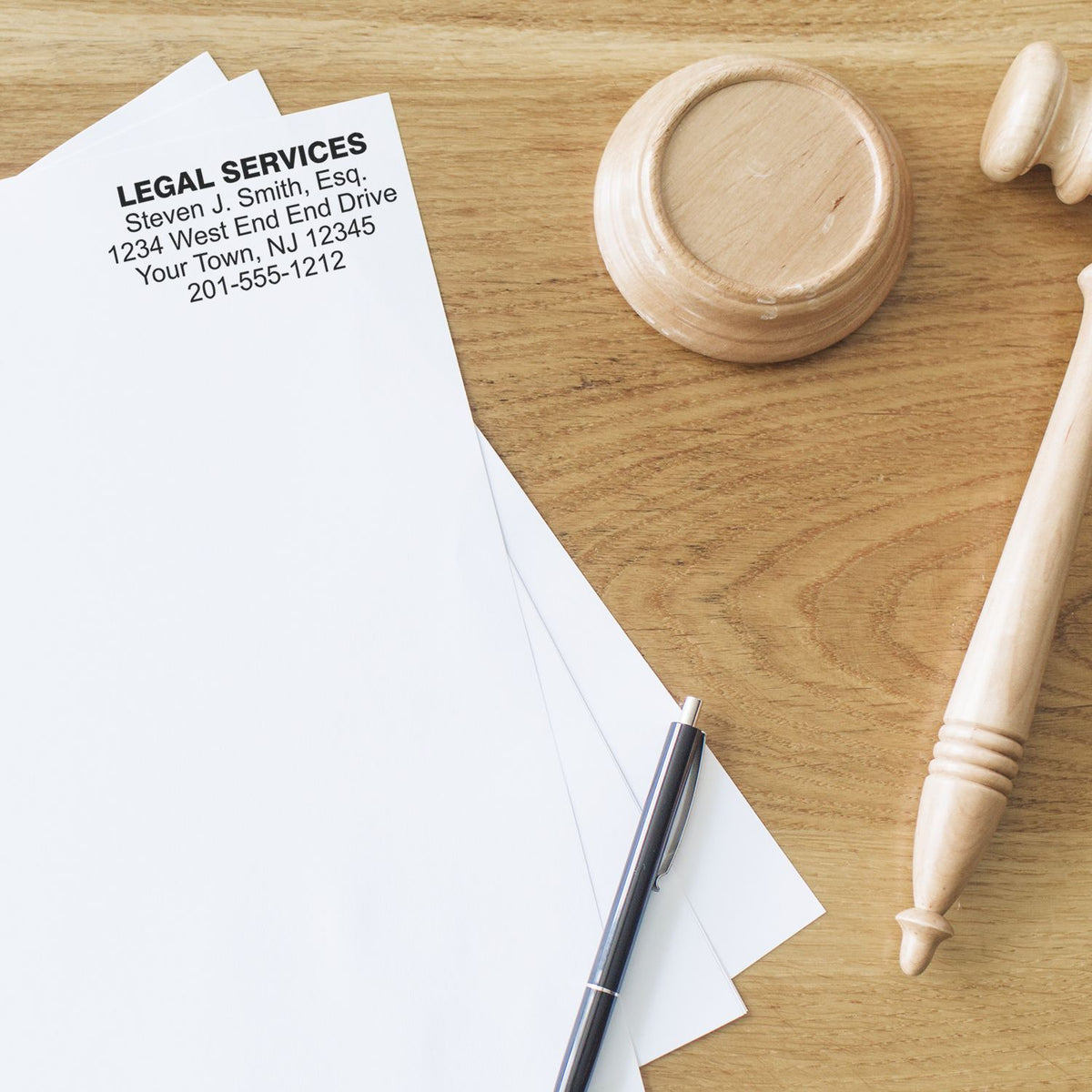 Legal services mail piece with attorney contact and office stamp on wooden desk, symbolizing law firm communication and court help.