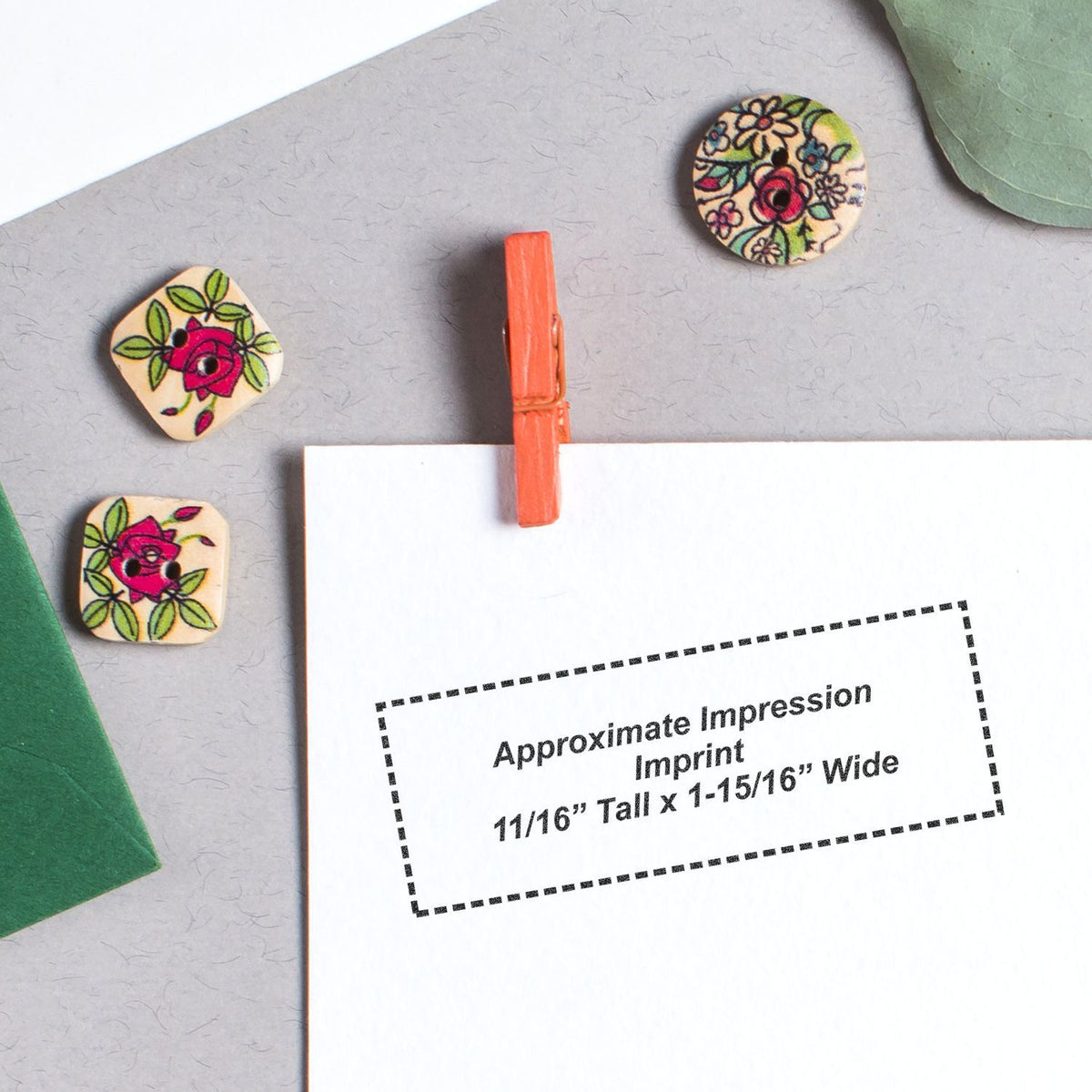 Floral wooden disc pins on craft card, showing approximate impression size: 11/16 in tall x 1-15/16 in wide.