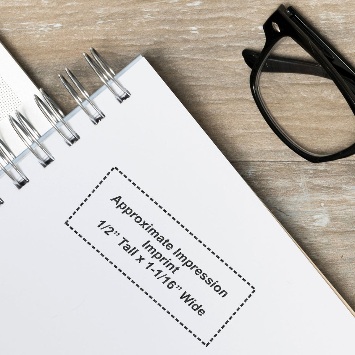 Notebook page with printed Approximately timeline information, binder rings, and black eyeglasses on desk background