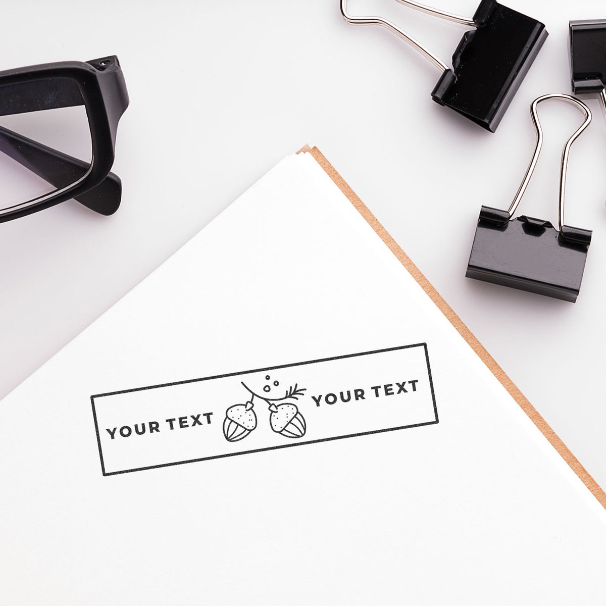 Office tech flat lay with smartphone, eyeglasses, binder clips, and pencil; branding mockup with placeholder Your Text banner
