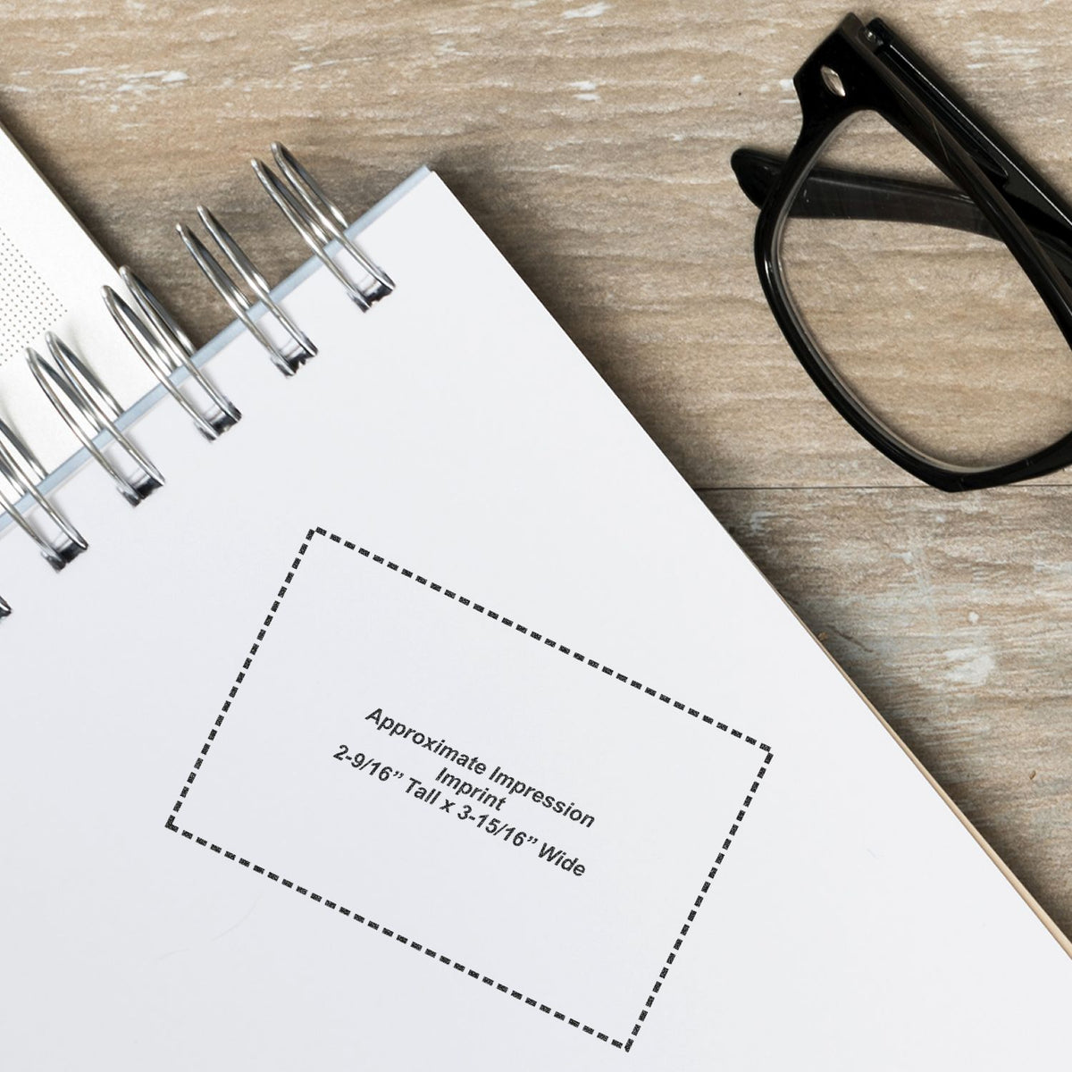 Imprint measurement template for branding, showing approximate impression size 2-9/16 x 3-5/16 wide, with binder clips and eyeglasses
