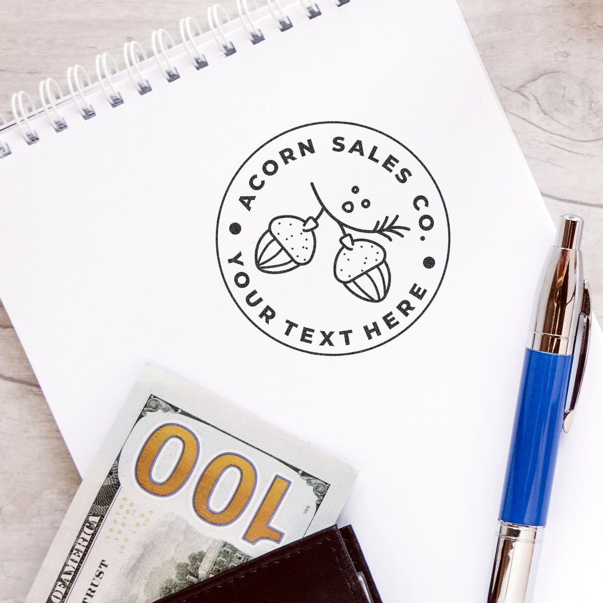 Acorn Sales branded notebook cover with acorn logo and Your Text Here layout for marketing and business promotion.