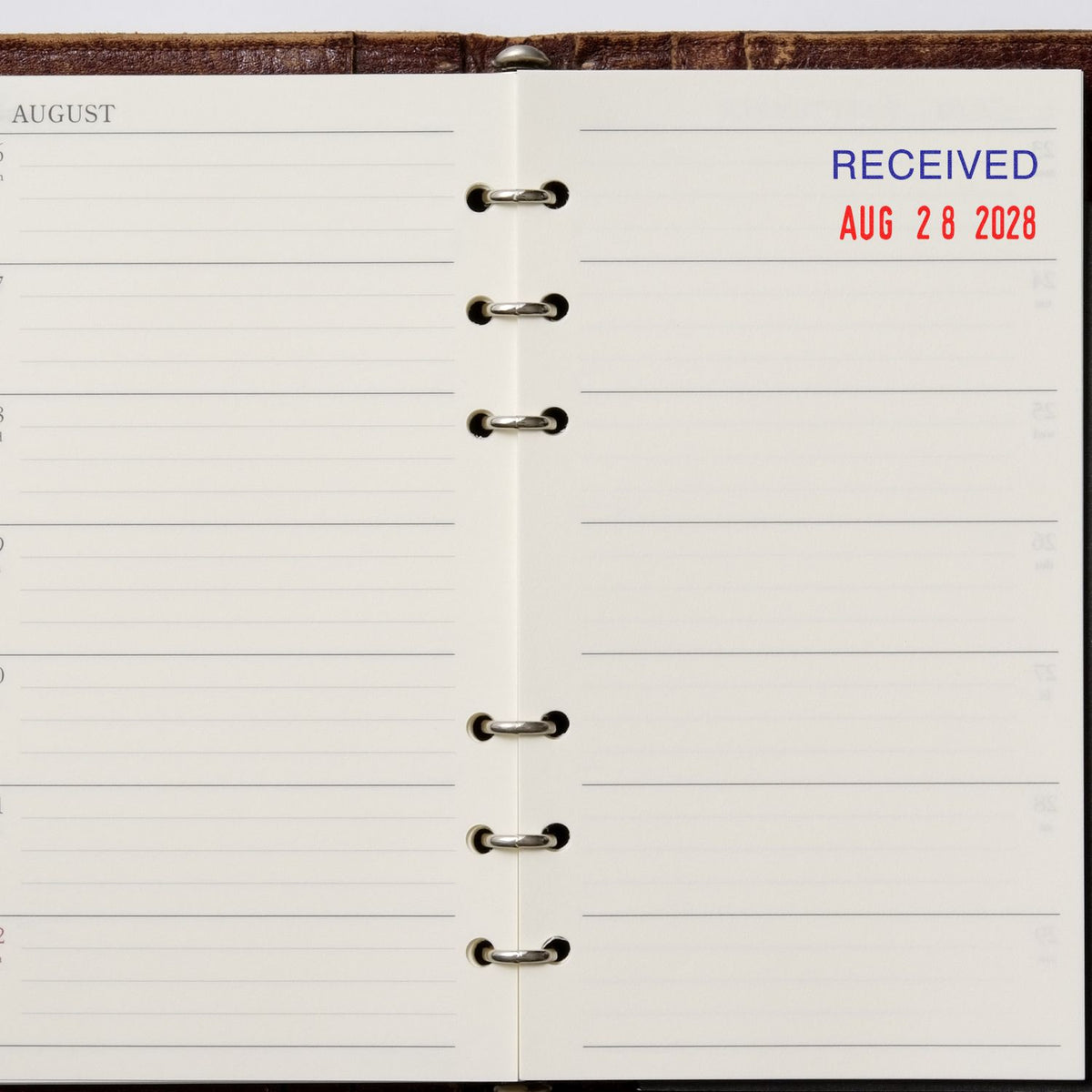 Open August planner page with Received Aug 28 2028 date stamp on a ring-bound diary.