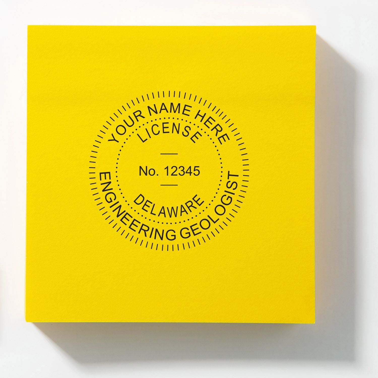 Bright yellow Delaware engineering geologist license box with circular black text and No. 12345 label design.