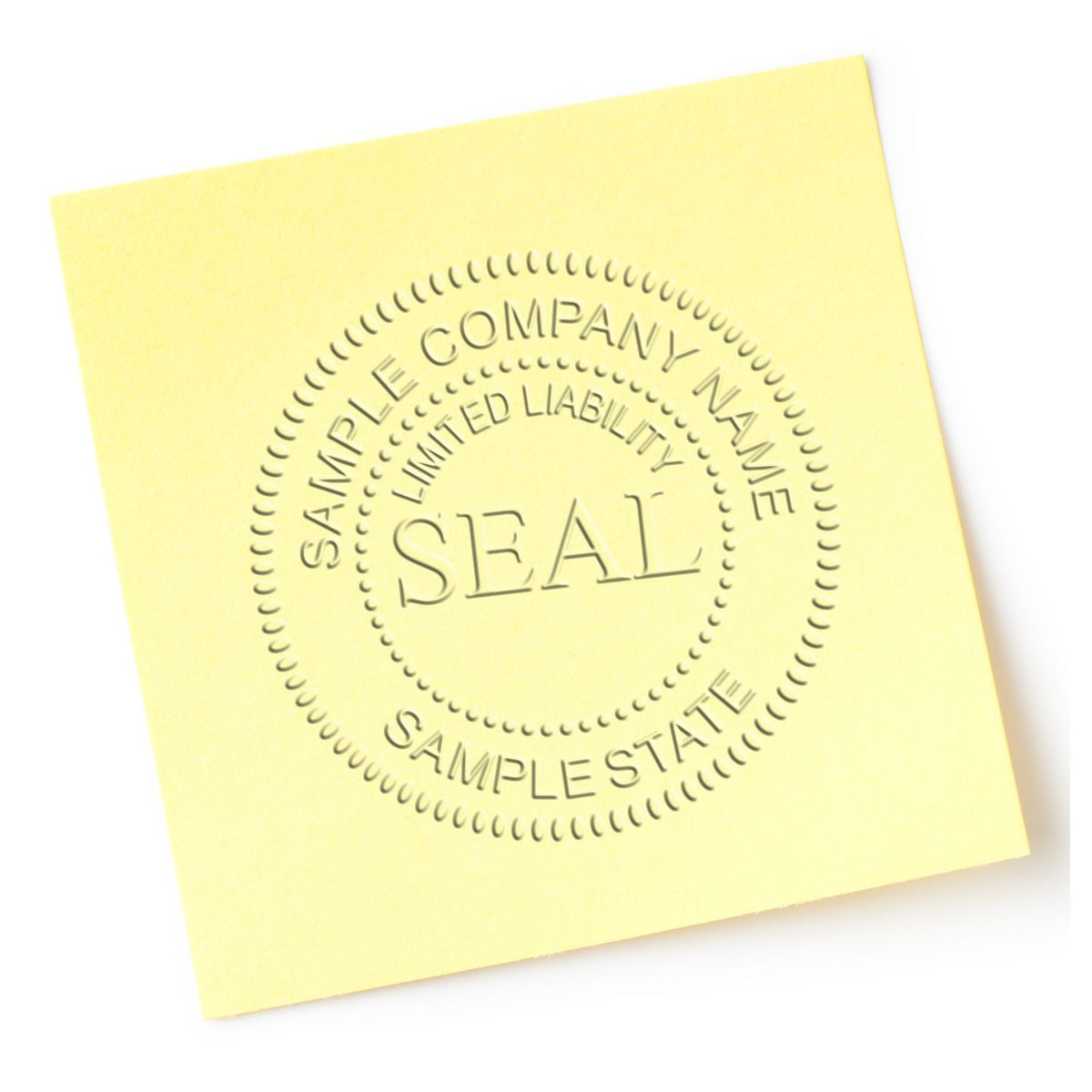 Yellow sample company name seal on a sticky note with embossed limited liability company text for branding and business design.