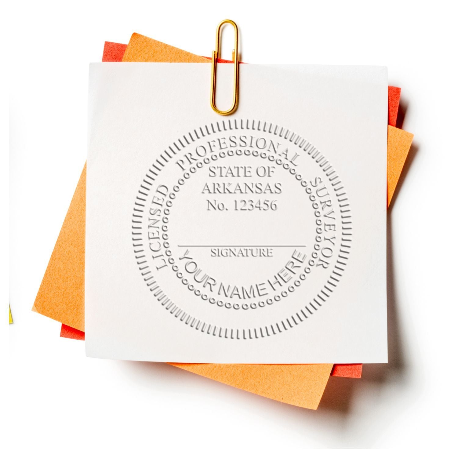 Arkansas professional surveyor license seal stamped on document with paperclip and sticky notes, certification paperwork close-up.