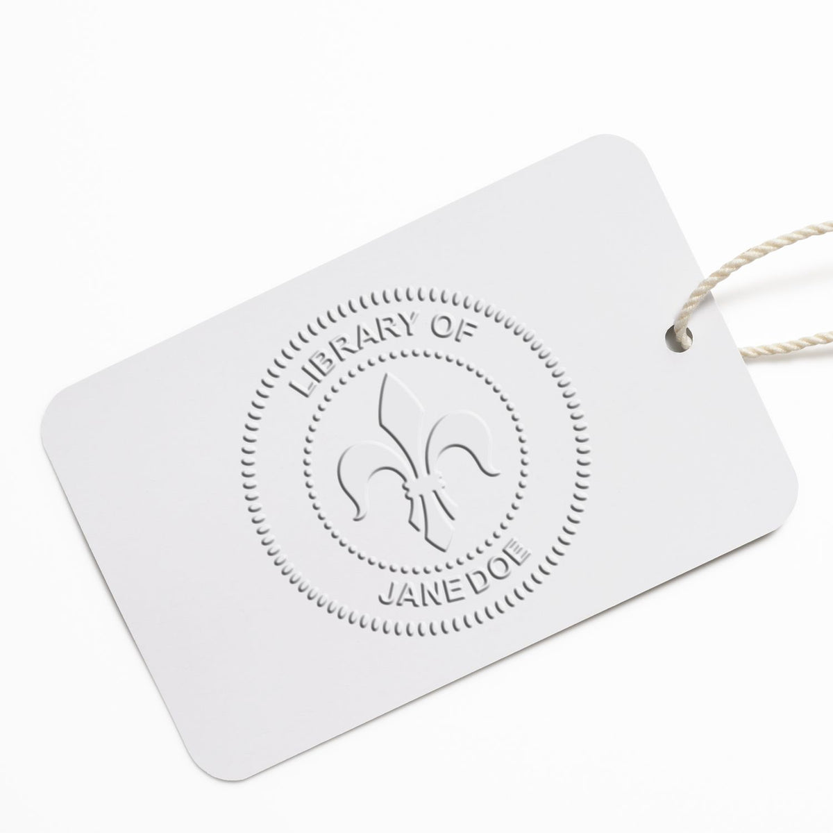 White embossed Library of Jane Doe hanging tag with minimalist logo on a clean background