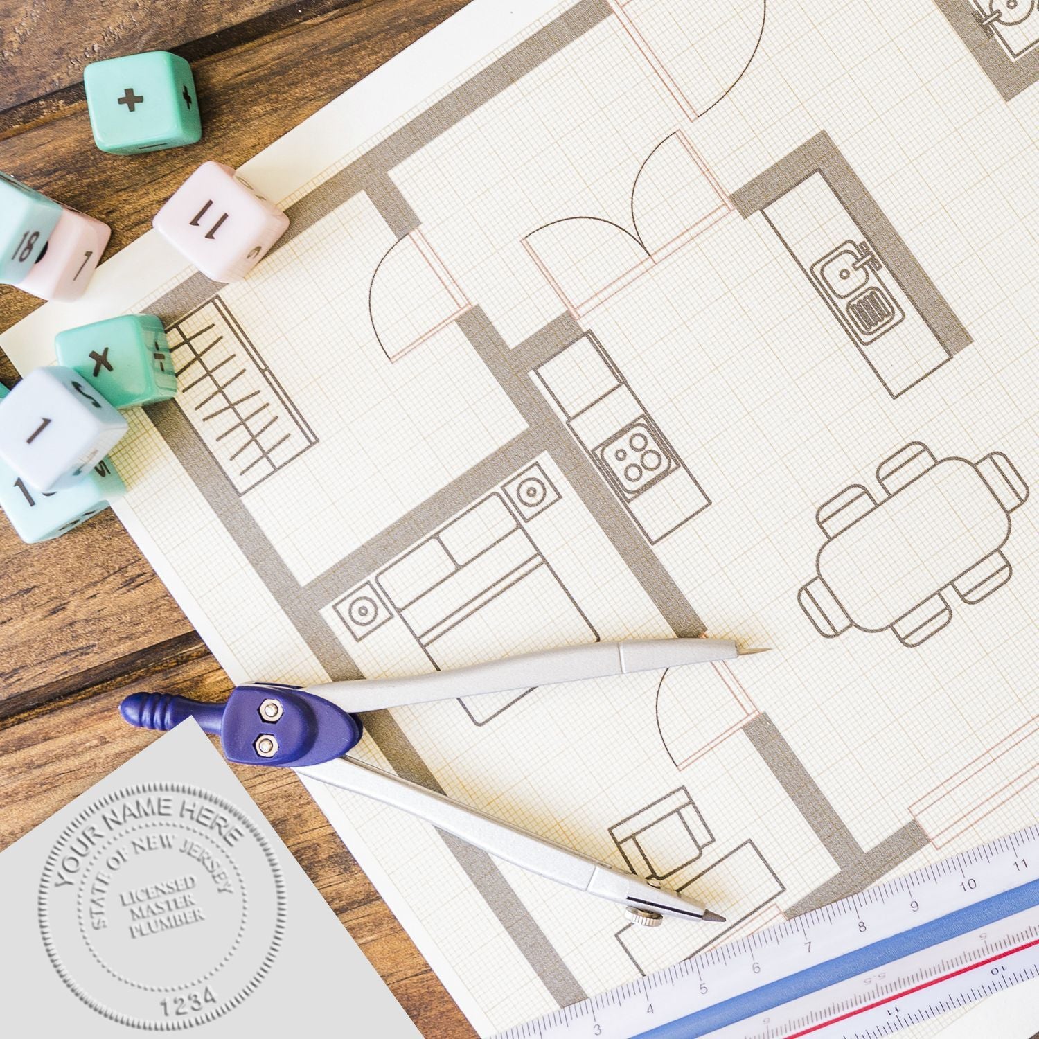 Architectural floor plan with drafting compass, rulers, and design tools on a wooden table for home layout planning.