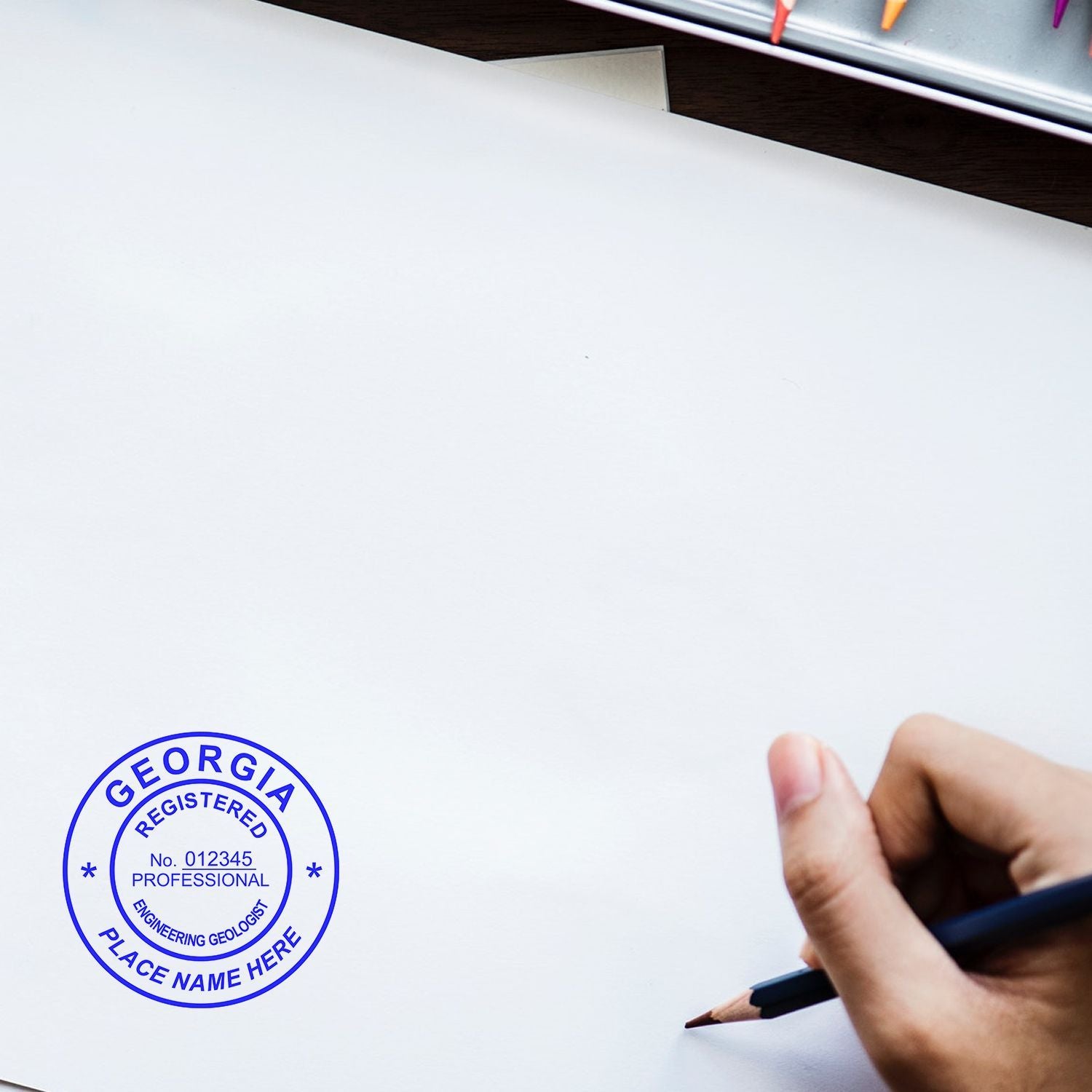 Blank engineering geology document with Georgia Registered Professional Engineering Geologist stamp and hand holding pencil