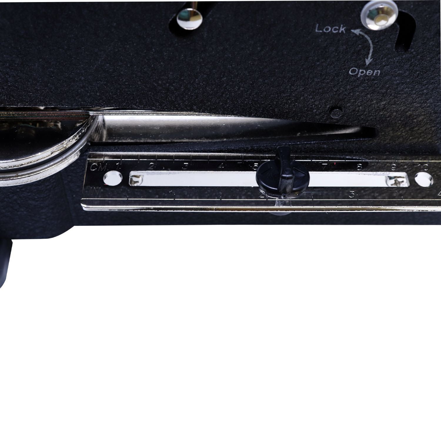 Close-up of a sewing machine stitch length adjustment dial with lock and open markings.