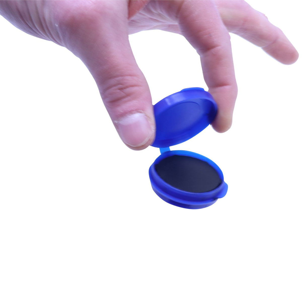Hand opening blue contact lens case on a white background