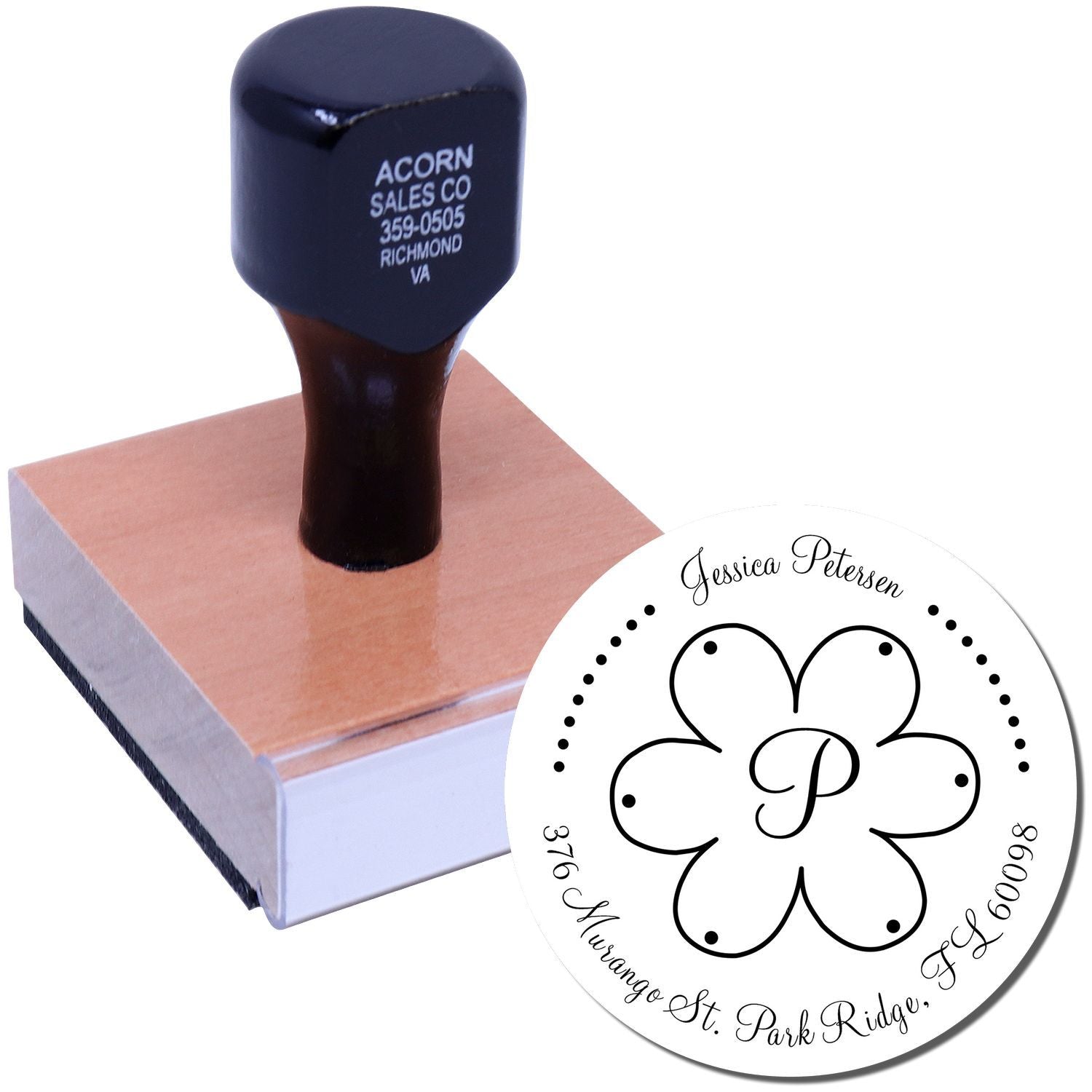 Custom self-inking address rubber stamp with floral monogram and return address for personalized mailing.