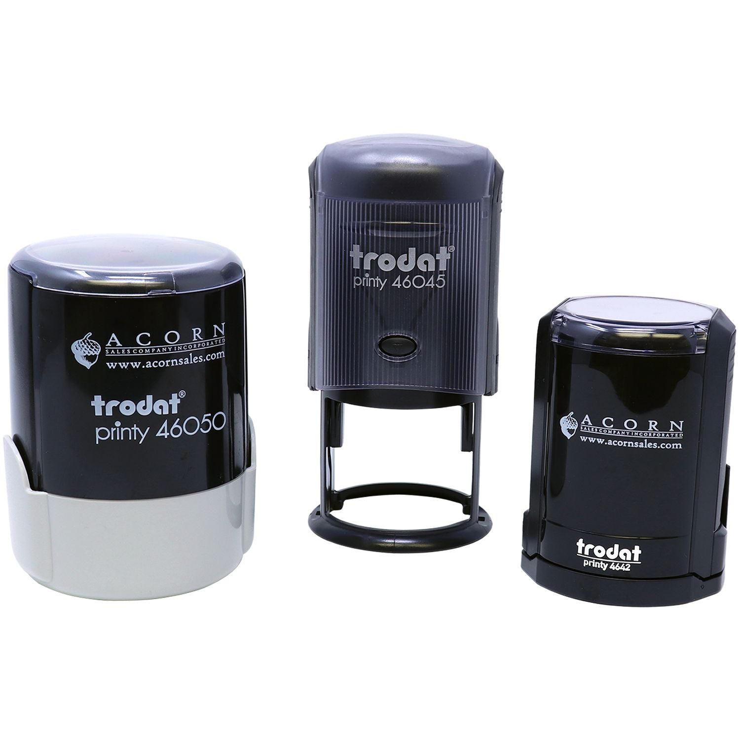 Three Trodat self-inking custom logo stamps on a white background, including Printy 46050, 46045, and 4642 models.
