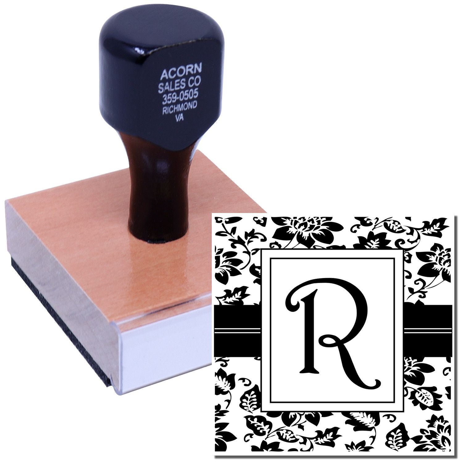 Custom monogram rubber stamp with floral border and initial R, shown on a wooden stamp mount for personalized branding.