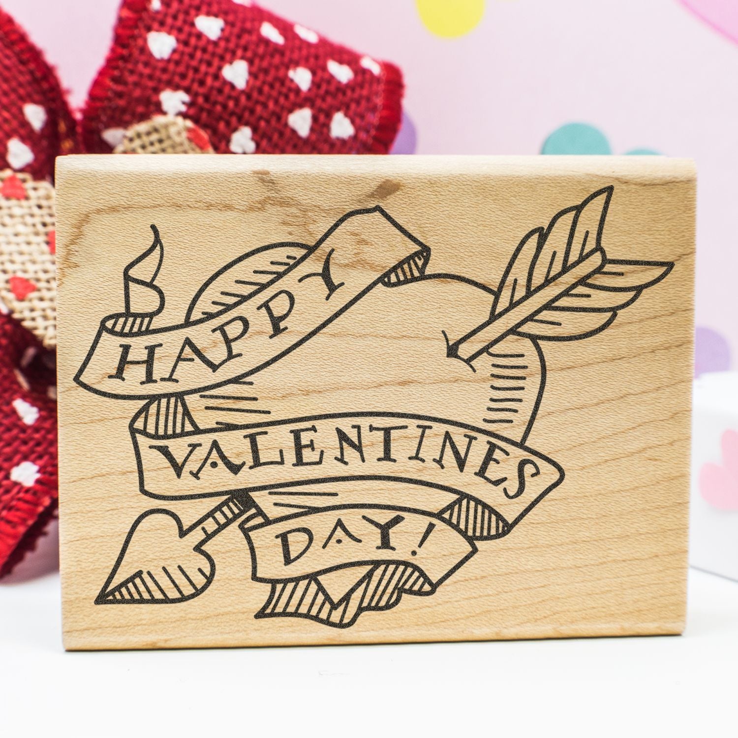 Wooden Happy Valentines Day stamp with heart banner, romantic holiday craft decoration.