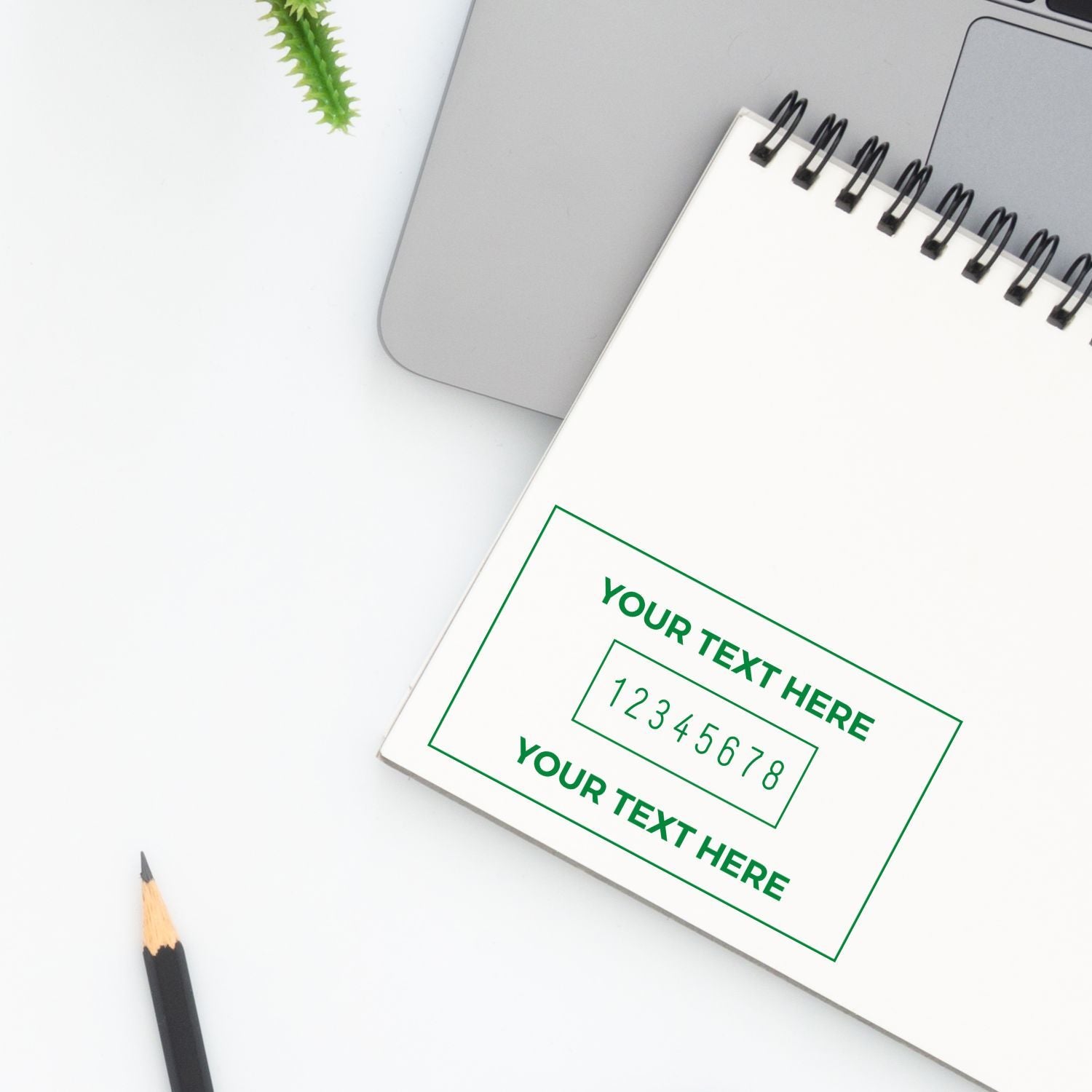 Minimalist notebook mockup beside a laptop and pencil on a white desk, ideal for branding, stationery, and office design.