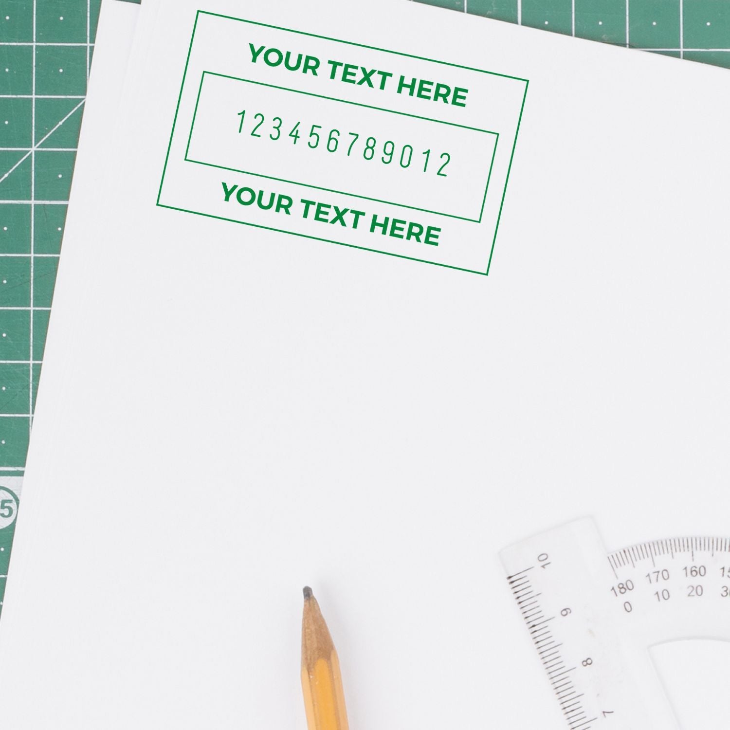 Printable greeting card design mockup on cutting mat with green Your Text Here template and 123456789012 numbering guide.