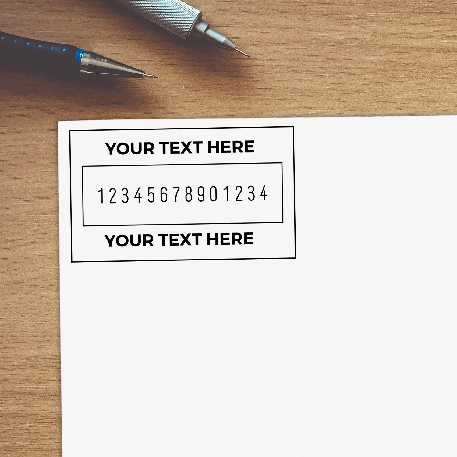 Wood desk stationery scene with pens and an editable business card template for contact details and custom text