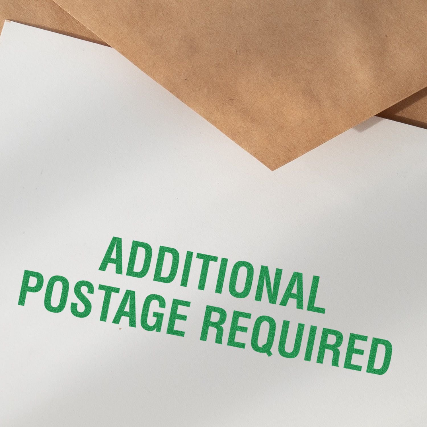 Close-up of shipping label text Additional Postage Required, indicating extra postage is needed for delivery.