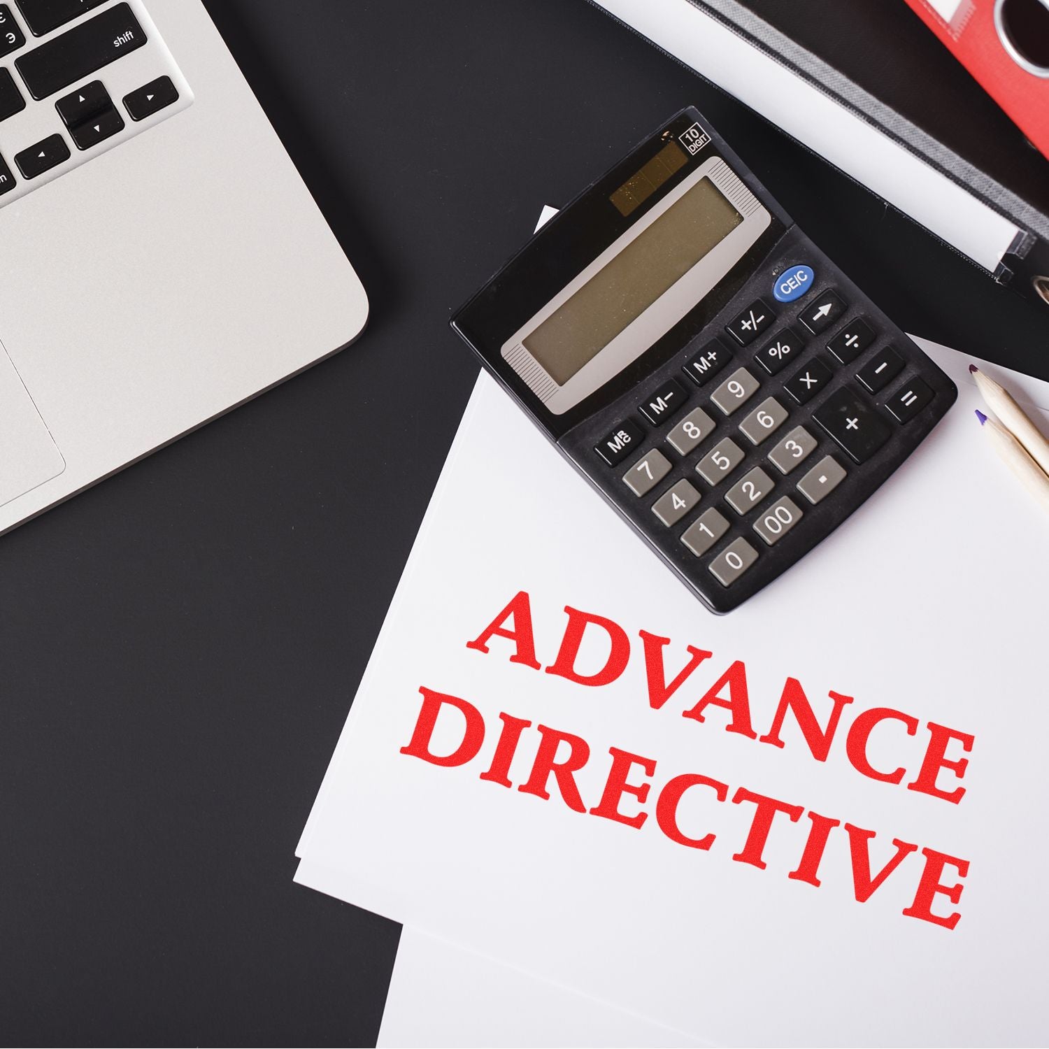 Advance directive healthcare document and calculator on desk, highlighting end-of-life planning and medical decision support for families.