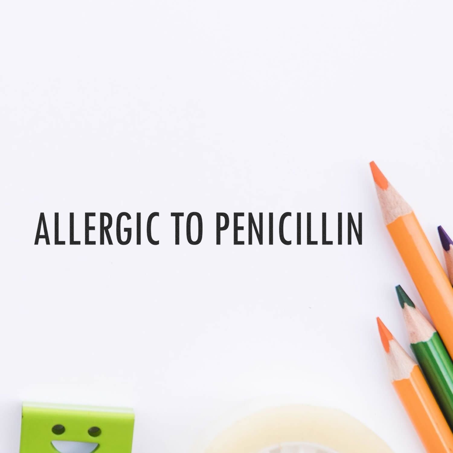 Allergic to penicillin warning text on stationery with pencils, highlighting penicillin allergy awareness and safety guidance.