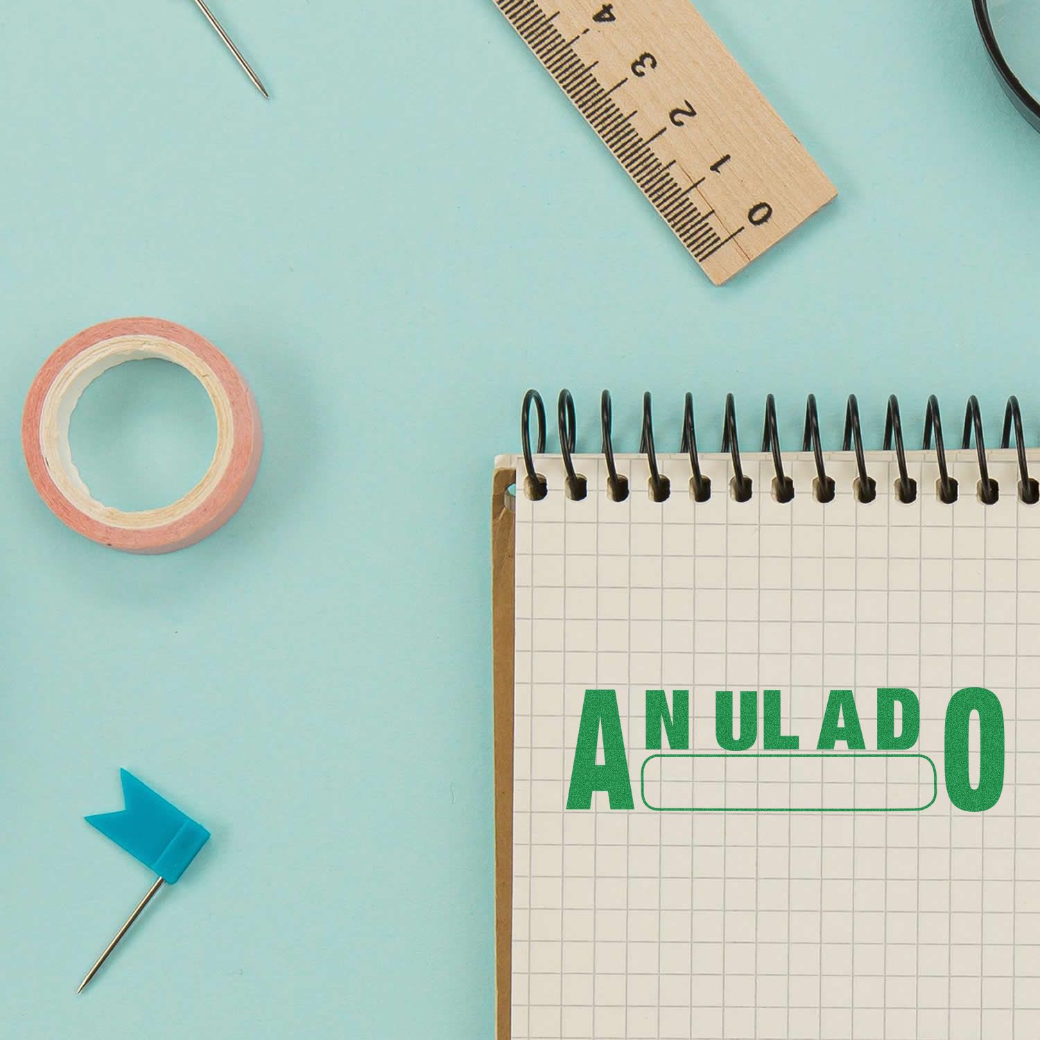 Notebook calendar with ANULADO label and stationery tools, symbolizing an annual cancellation or rescheduling.