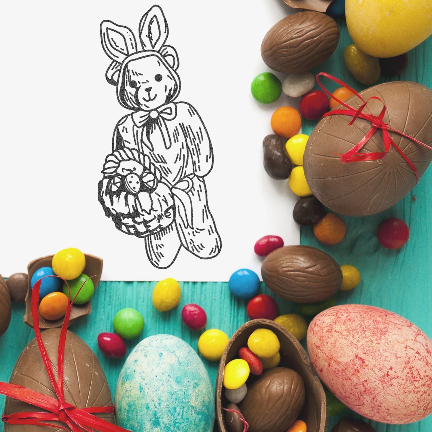Easter bunny coloring page surrounded by chocolate eggs, candy, and colorful sweets on a turquoise background.