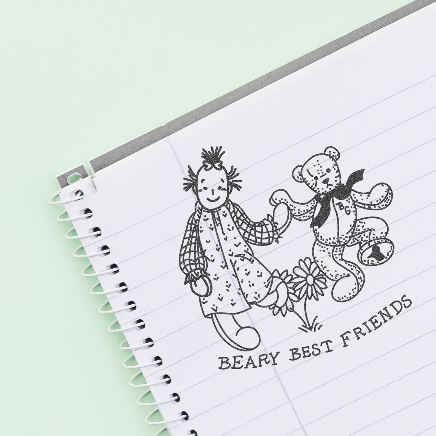Notebook page with cute Beary Best Friends doodle of a child and teddy bear on lined paper.