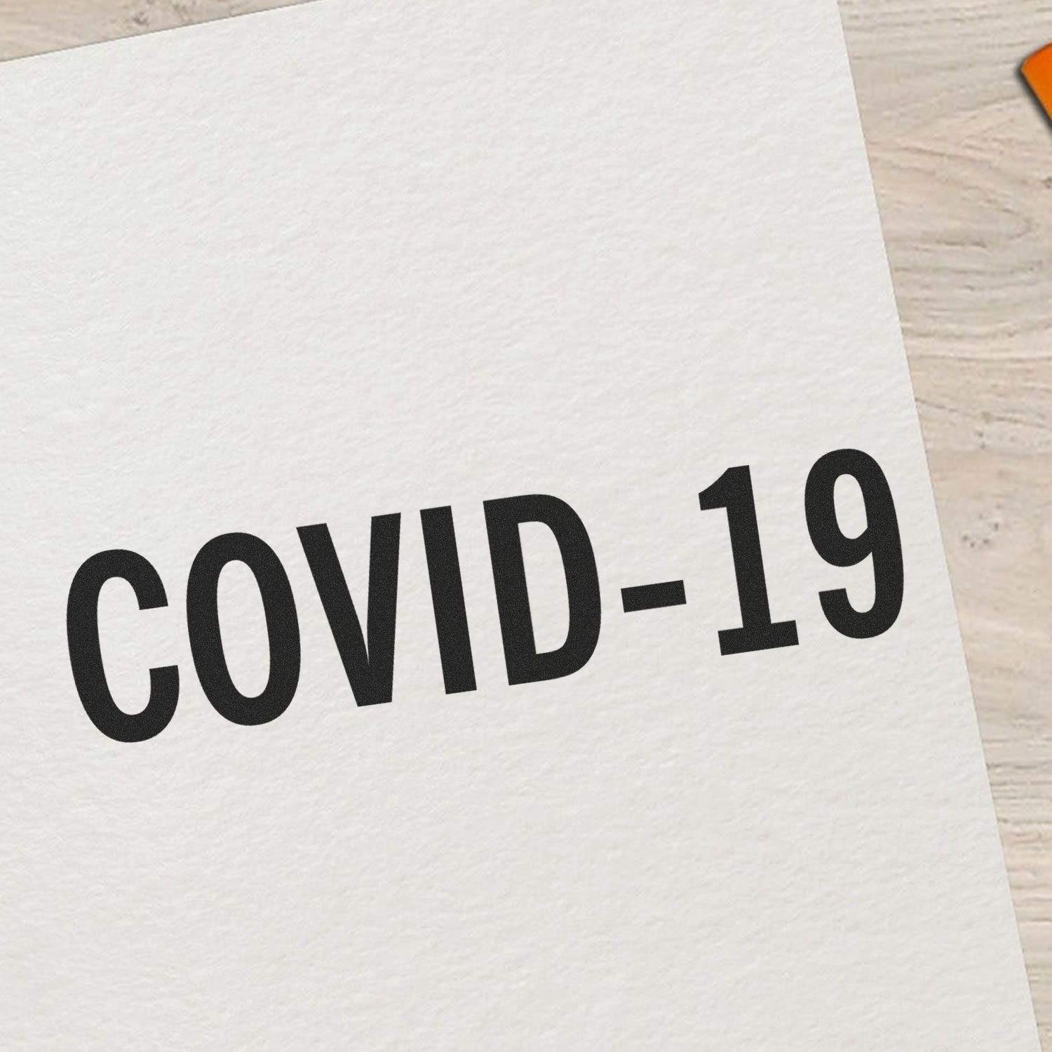White card showing bold COVID-19 text for health awareness, pandemic messaging, and COVID-19 safety information.