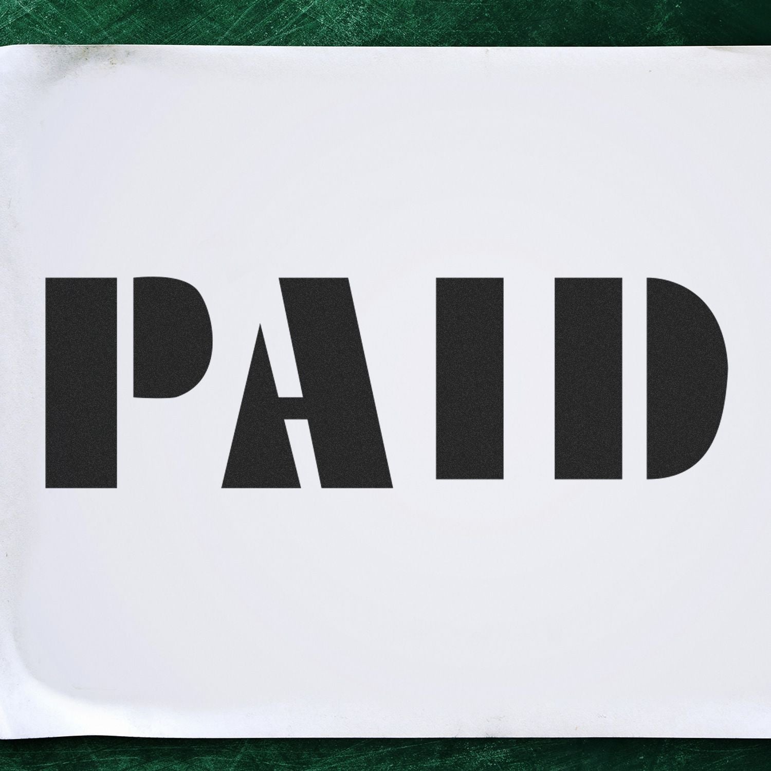 Bold black PAID stamp on white paper, indicating payment confirmation on an invoice or financial document.