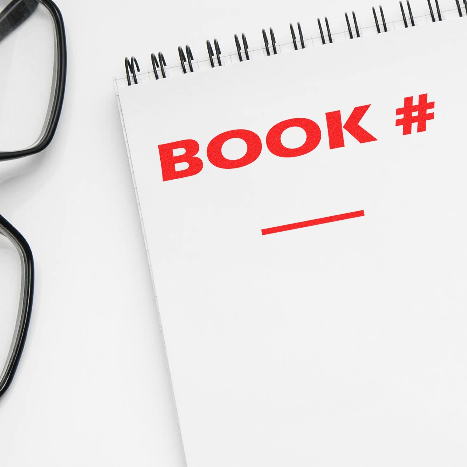 Open document page with red BOOK # label, highlighting book number tracking and catalog referencing.